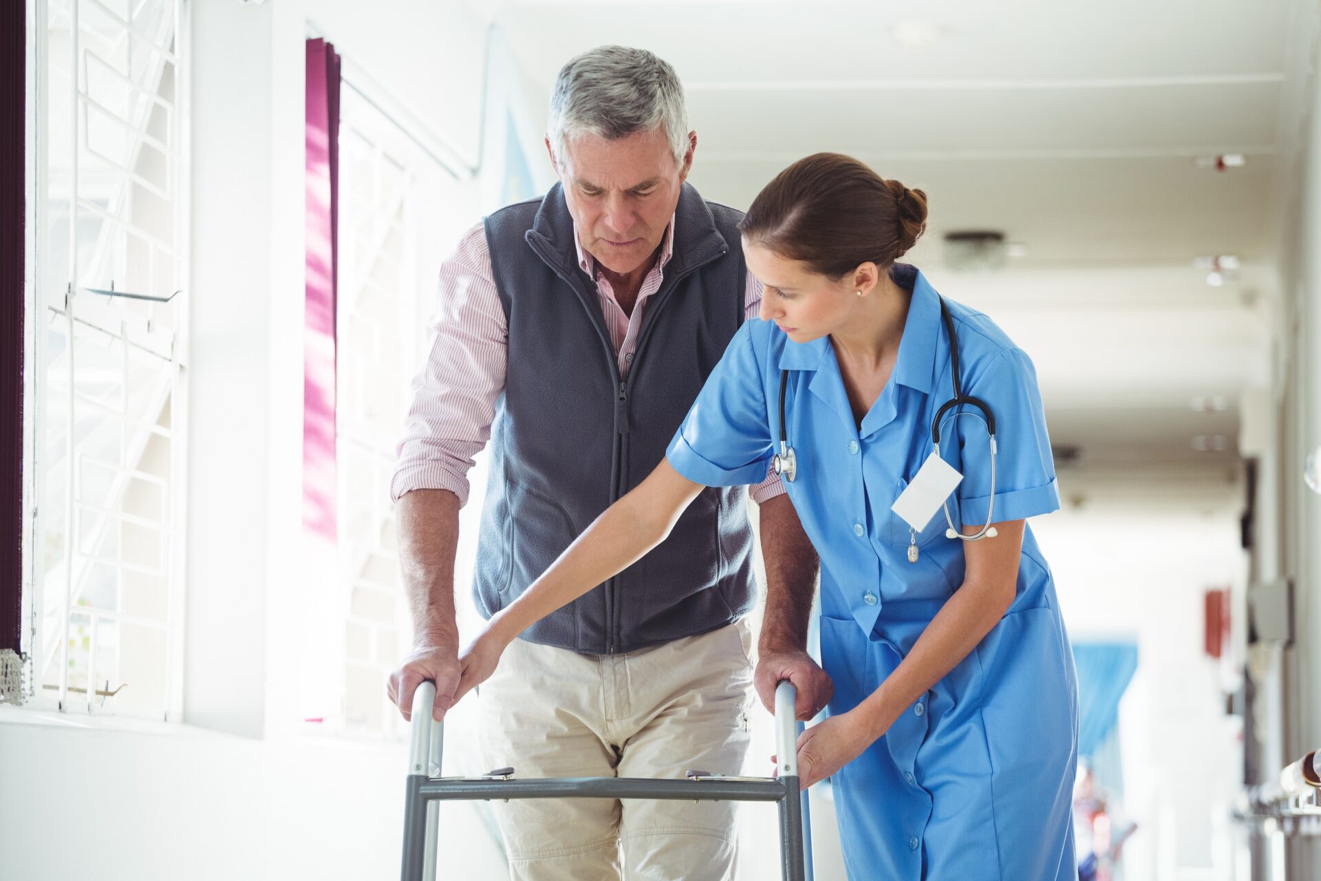 Nurse helping senior man